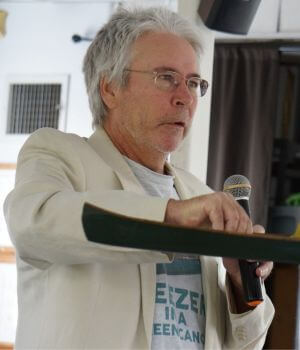 Photo of Kim Trevathan holding a microphone and speaking