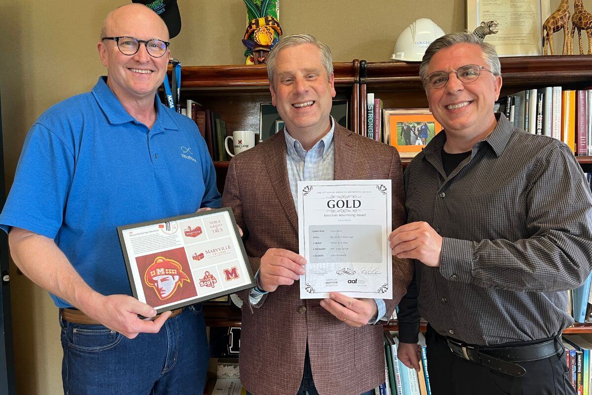 Photo of Dr. Bryan Coker and Visual Voice leaders holding certificates