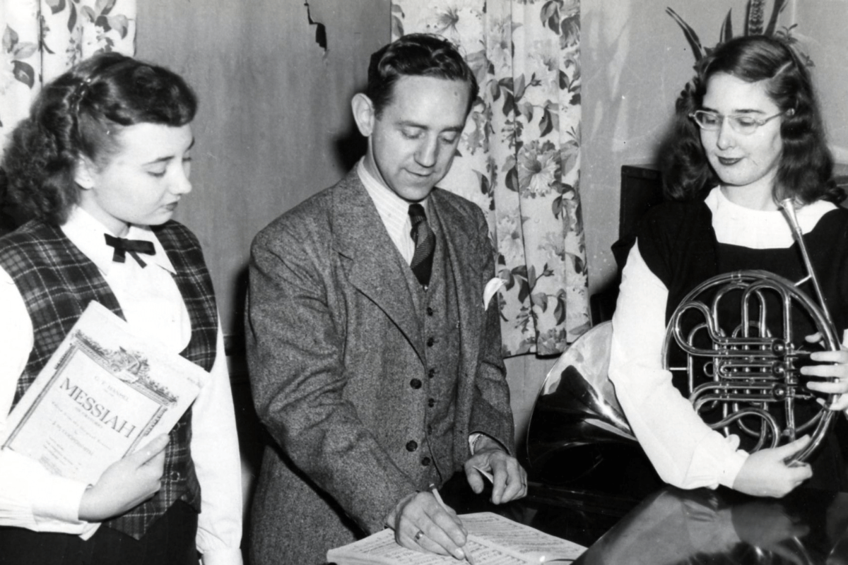 Photo of Harry Harter and two students rehearsing for "Messiah."