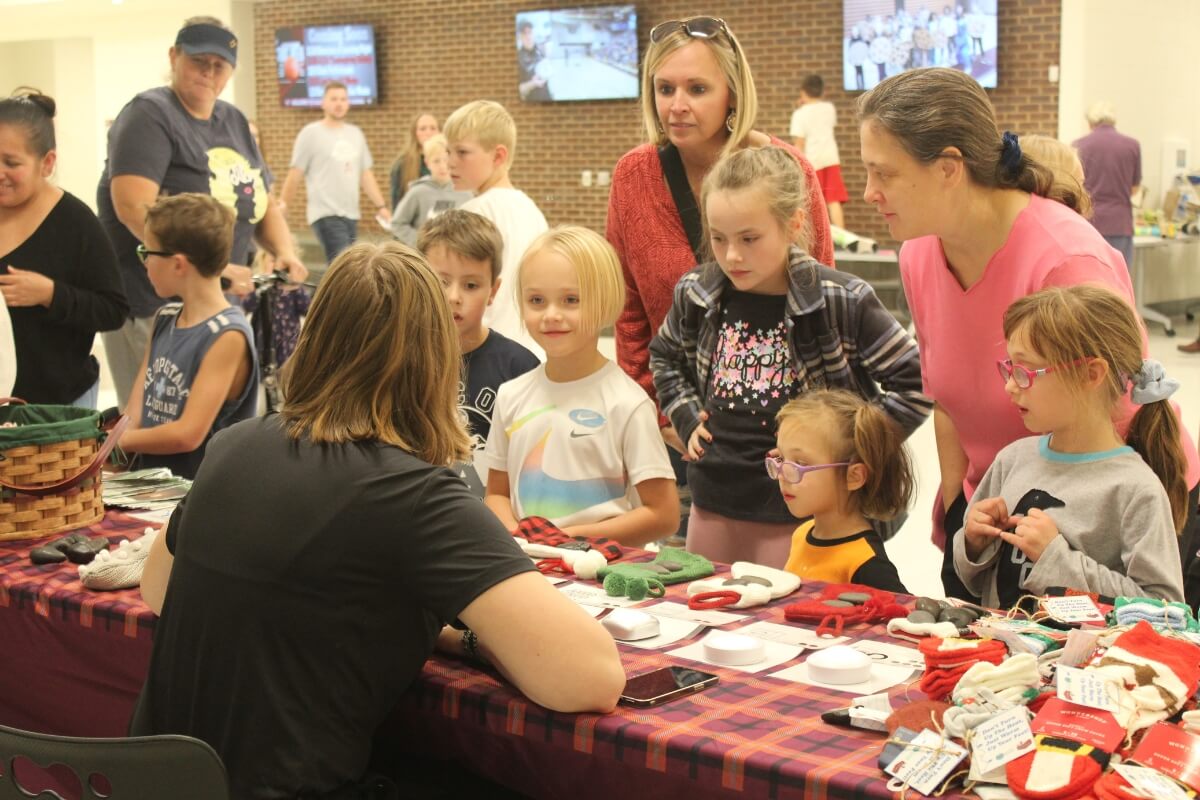 Photo of students gathered around a table