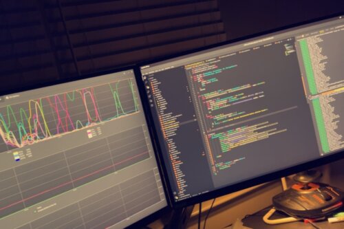 Photo of Nathan Keough's two-monitor work station