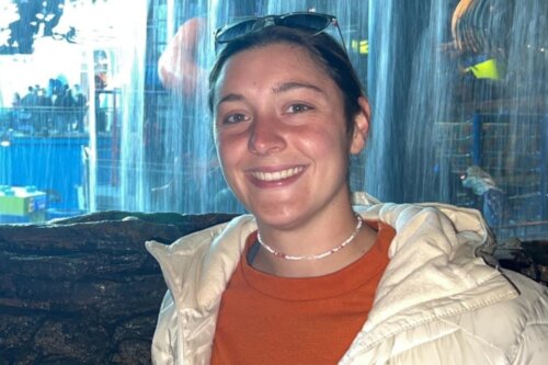 Photo of Sara Koonce smiling at an aquarium