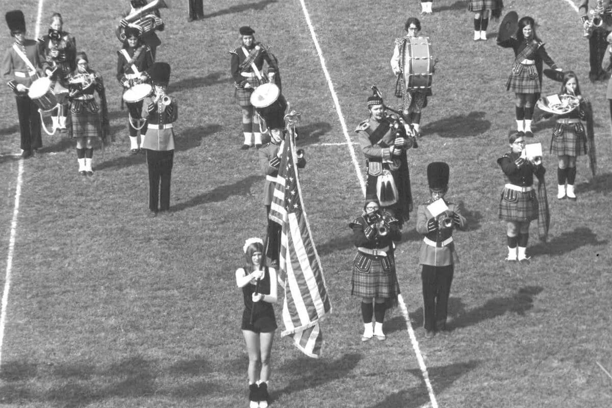Black and white photo of Highlander Band in mid-performance
