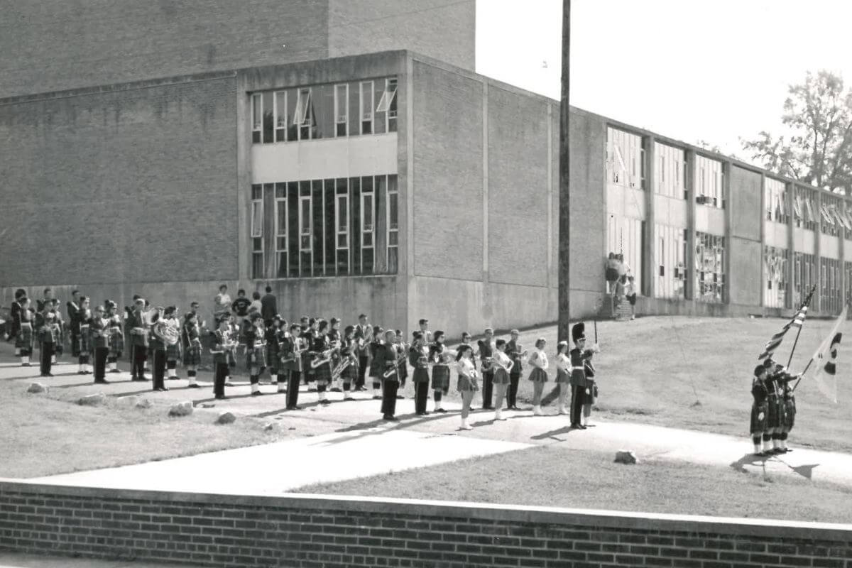 Black and white photo of the 1963 Highland Band preparing to march