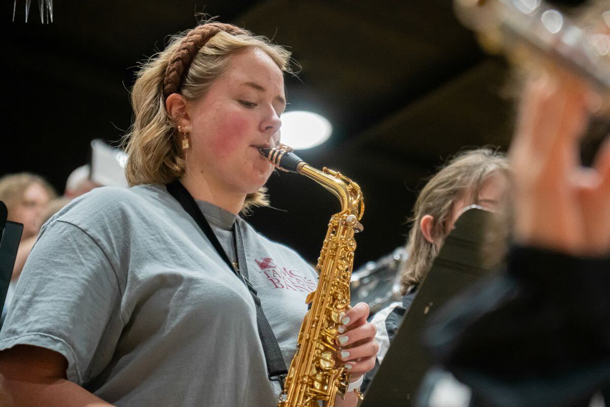 Photo of Becca Johnson playing saxophone