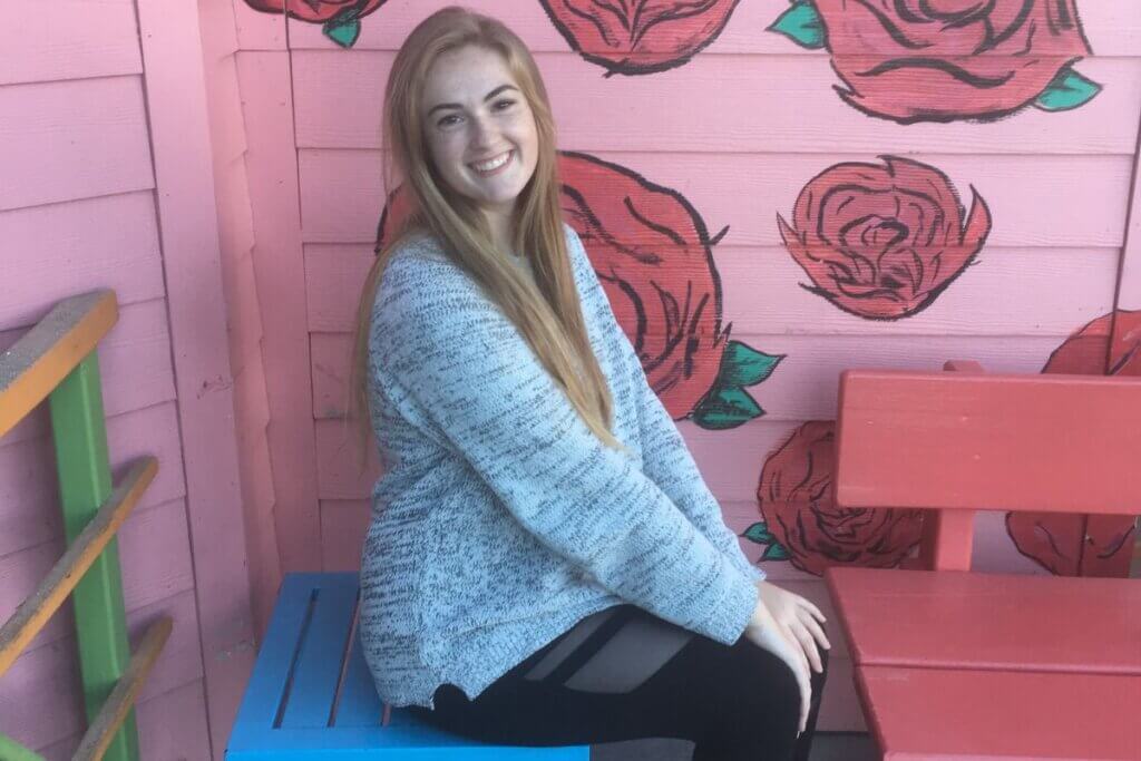Photo of Mackenzie Nicholas smiling and sitting down