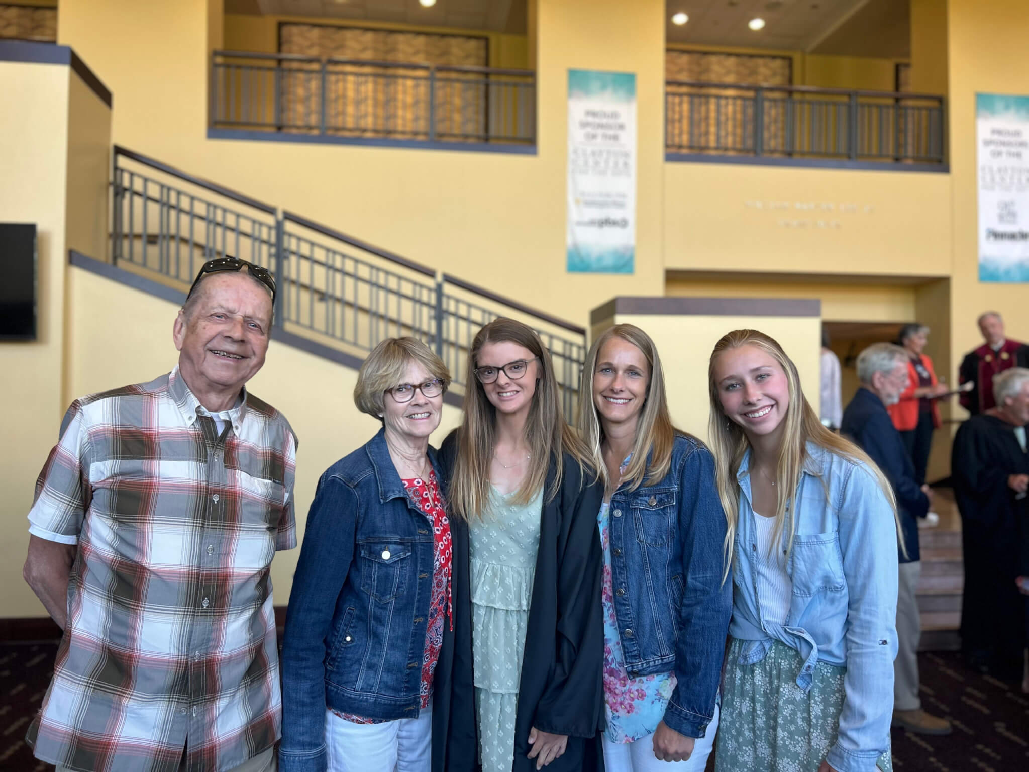 Maddie Cunningham and four members of her family in the foyer of the Clayton Center for the Arts on Maryville College's campus