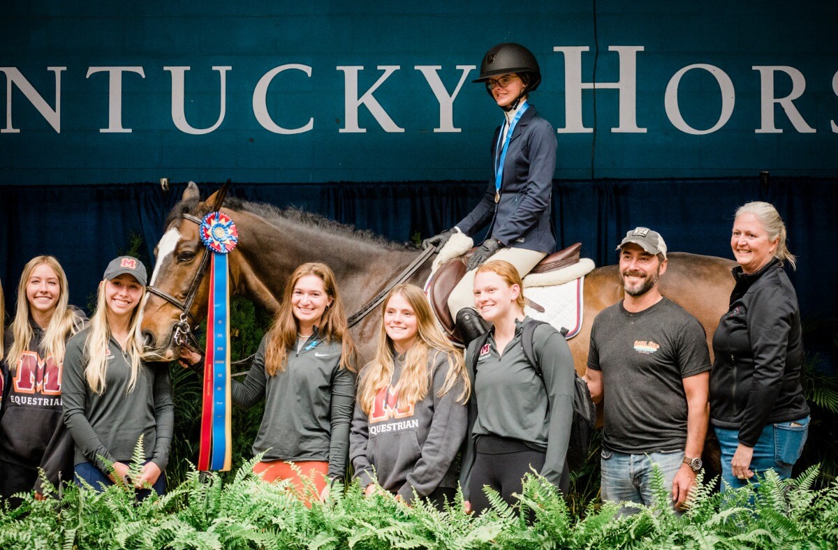 Maddie Cunningham on a horse with other member of the MC Equestrian team