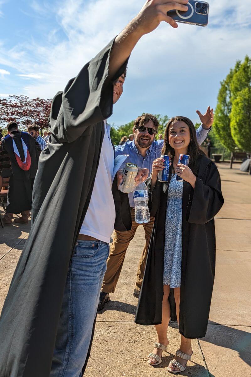 Photo of students taking a selfie on the Clayton Center Plaza.