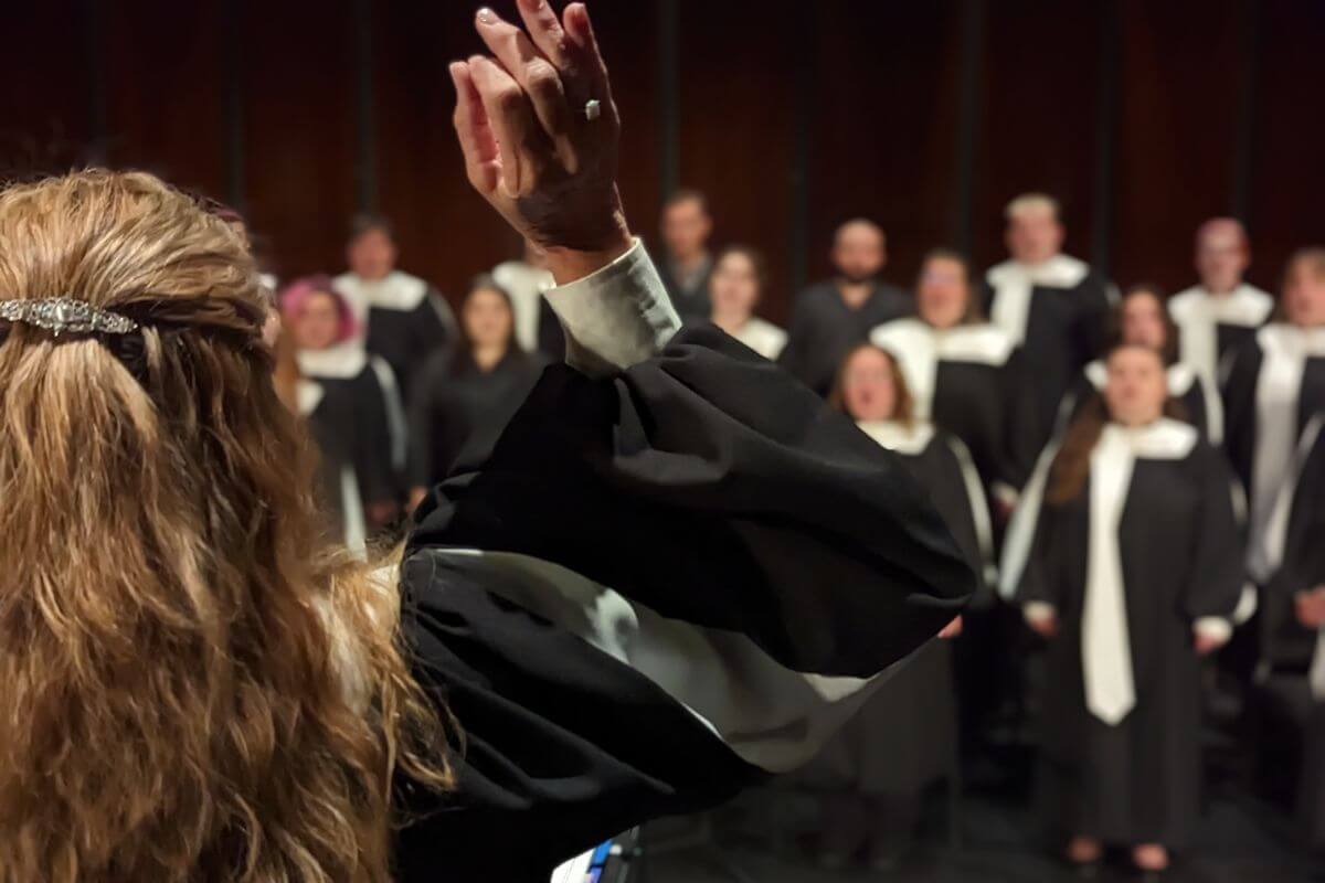 Photo of Stacey Wilner conducting the MC Concert Choir