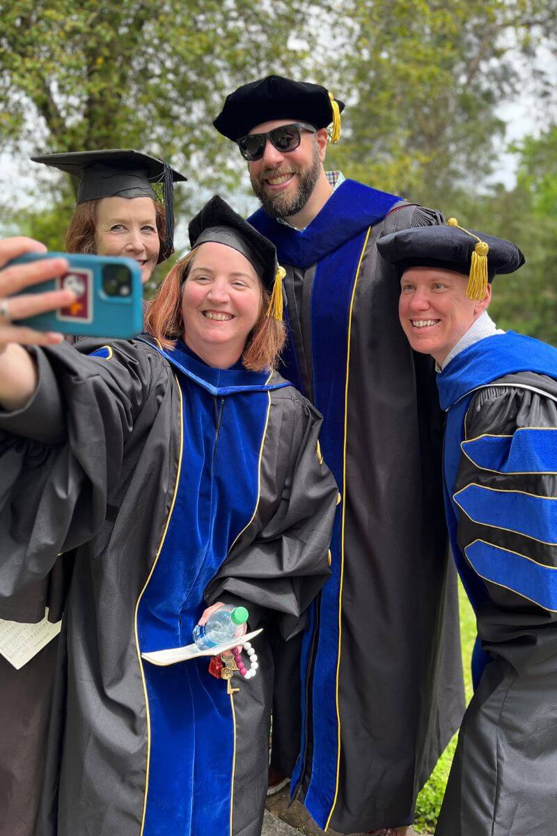 Photo of smiling members of the Maryville College faculty after Commencement 2023
