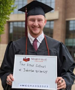Photo of Craig Harville in cap and gown at Commencement 2023
