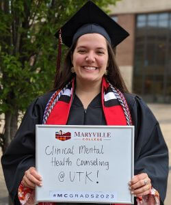 Photo of Haly Scott in cap and gown at MC Commencement 2023