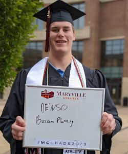 Photo of Jace Brittain in cap and gown at Commencement 2023