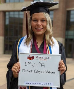 Photo of Kalli Knight in cap and gown at Commencement 2023