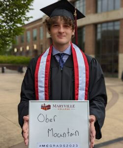 Photo of Matt Quizi in cap and gown at MC Commencement 2023