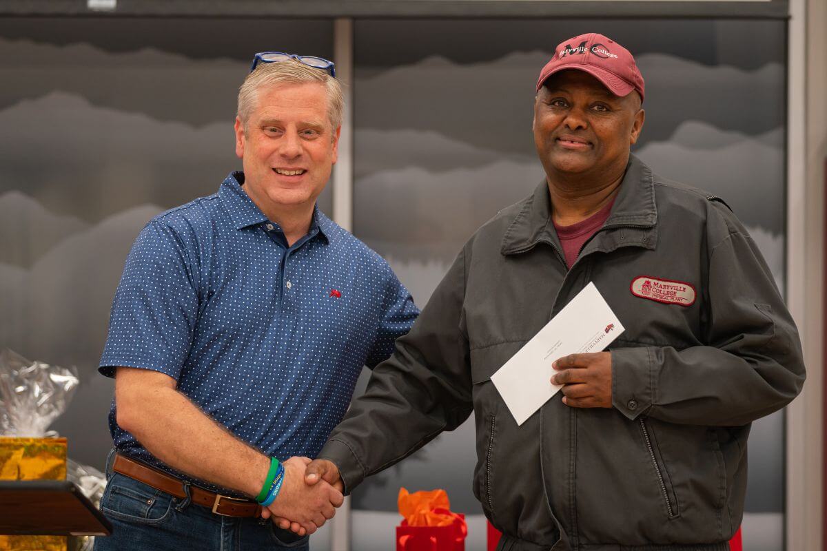 Photo of Dr. Bryan Coker with T.K. Germichal