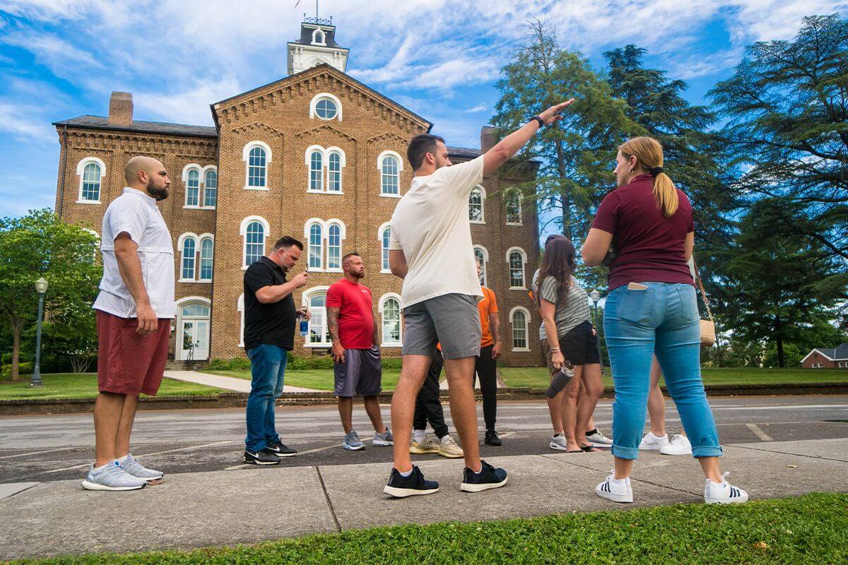 Photo of an Admissions counselor taking prospective students on one of Maryville College's summer Twilight Tours