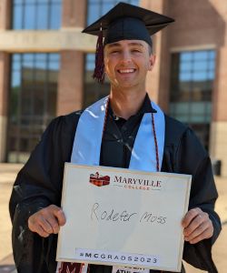 Photo of Will Hubbell in cap and gown at MC Commencement 2023