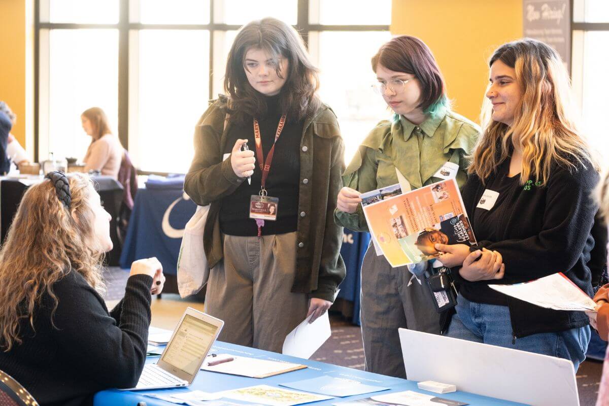 Photo of three Scots at the MC Career Fair