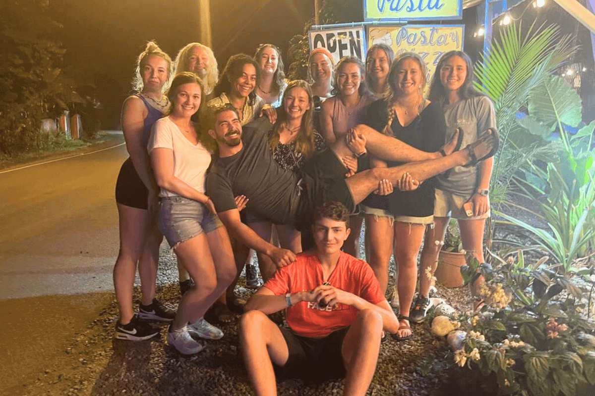 A group of MC students standing in Costa Rica in front of a restaurant.
