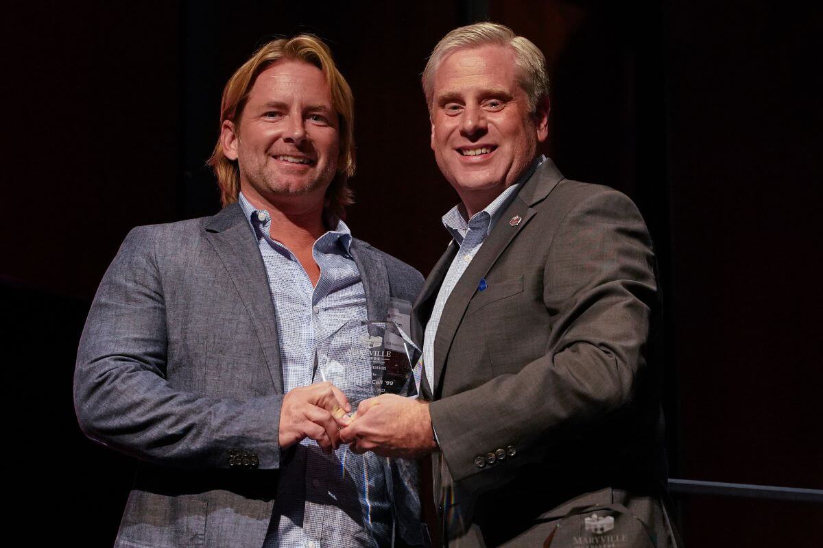 Photo of Adam McCall '99 with President Bryan Coker