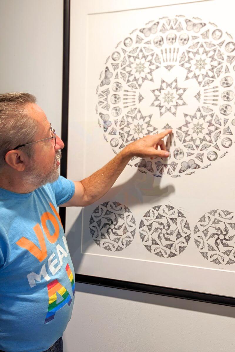 Photo of Carl Gombert explaining his creative process.