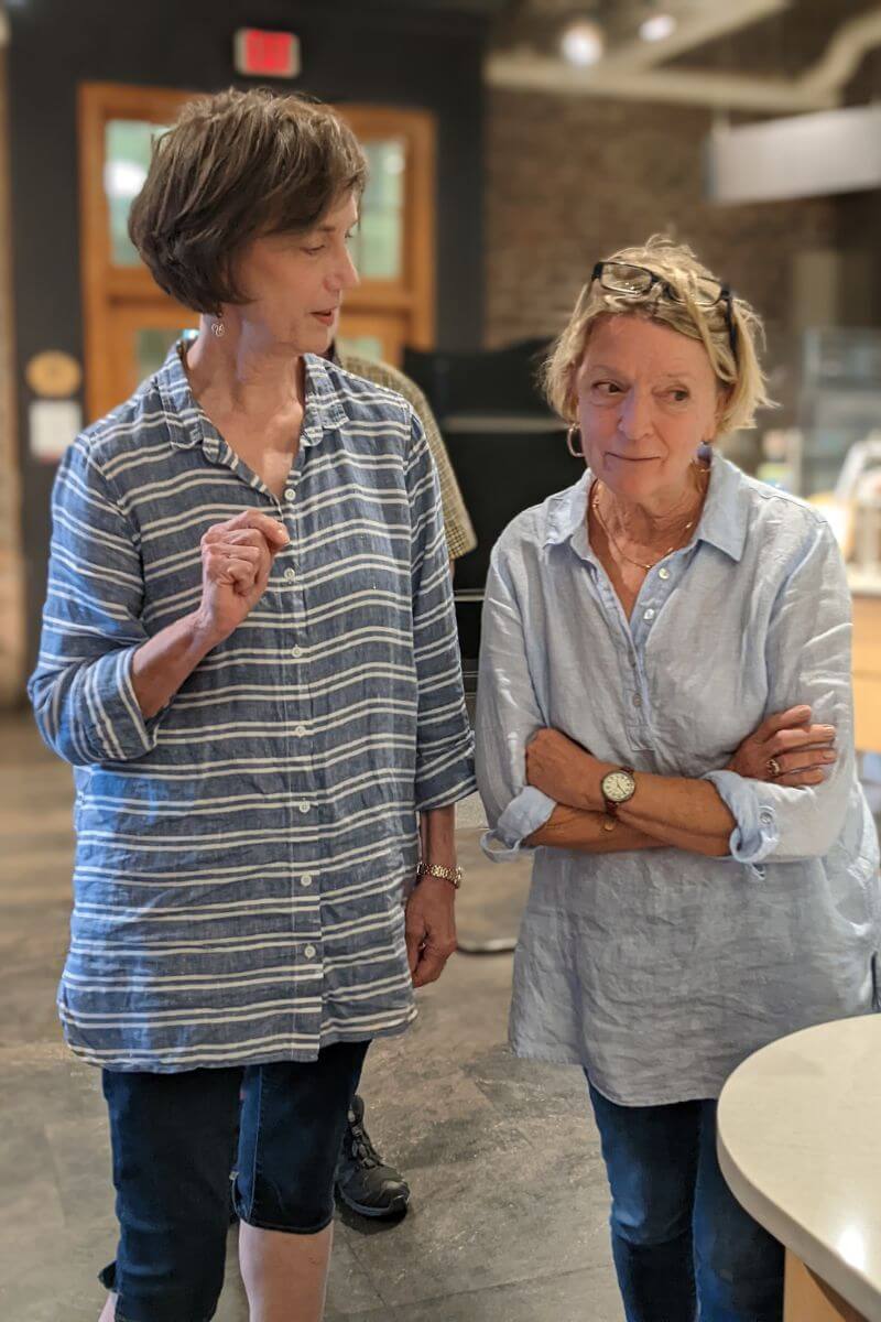 Photo of Amy Smock Sloboda '78 and Dana Alspaugh Blair '78 in Pearsons Hall in July 2023