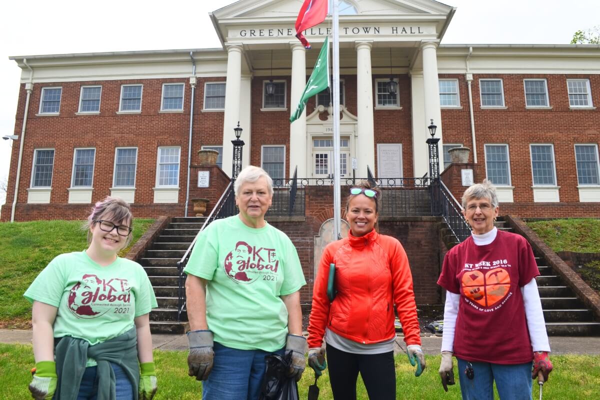 Photo of Maryville College alumni working on a KT Global project in front of the Greeneville Town Hall in Greeneville, Tennessee