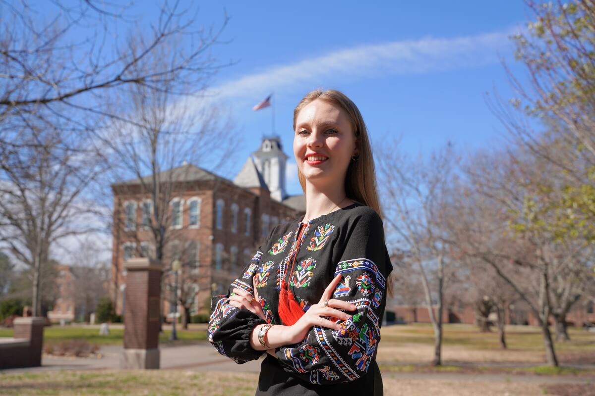Photo of Ukrainian exchange student Mariia Yanbergs standing on Humphreys Court