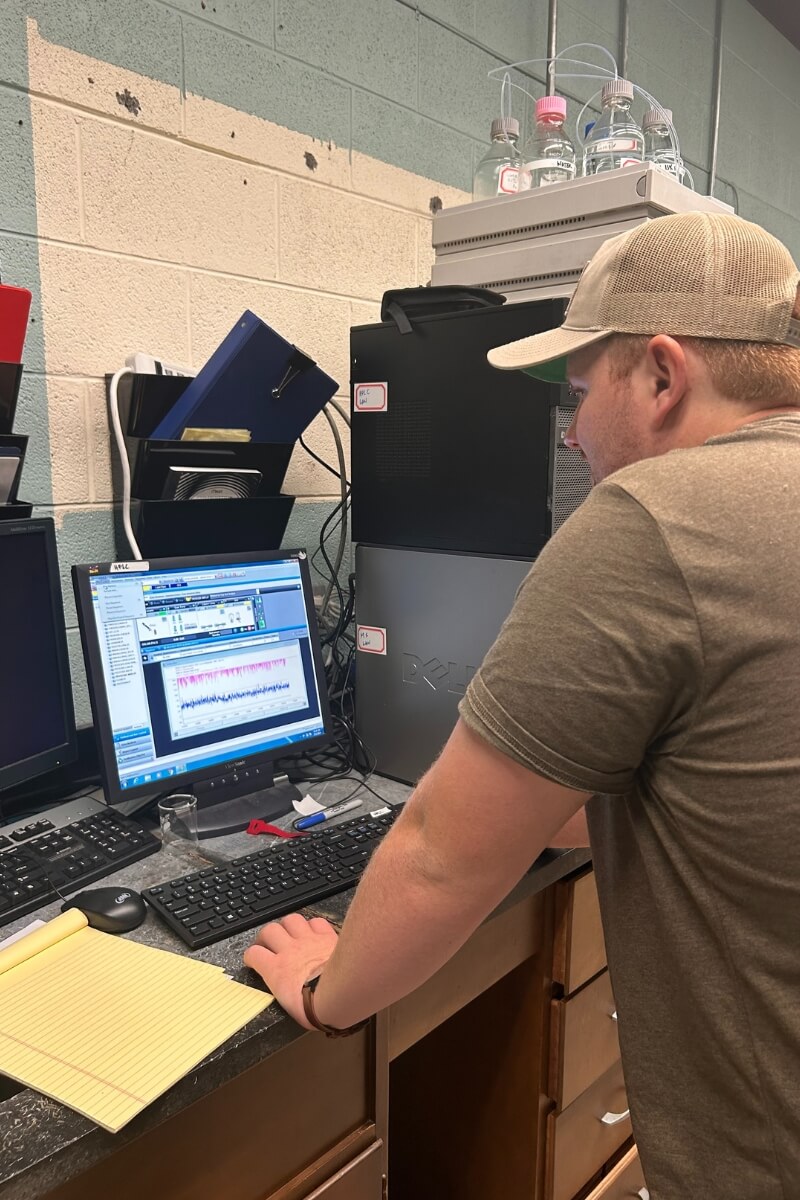 Photo of Colby Huffman '25 working at a computer