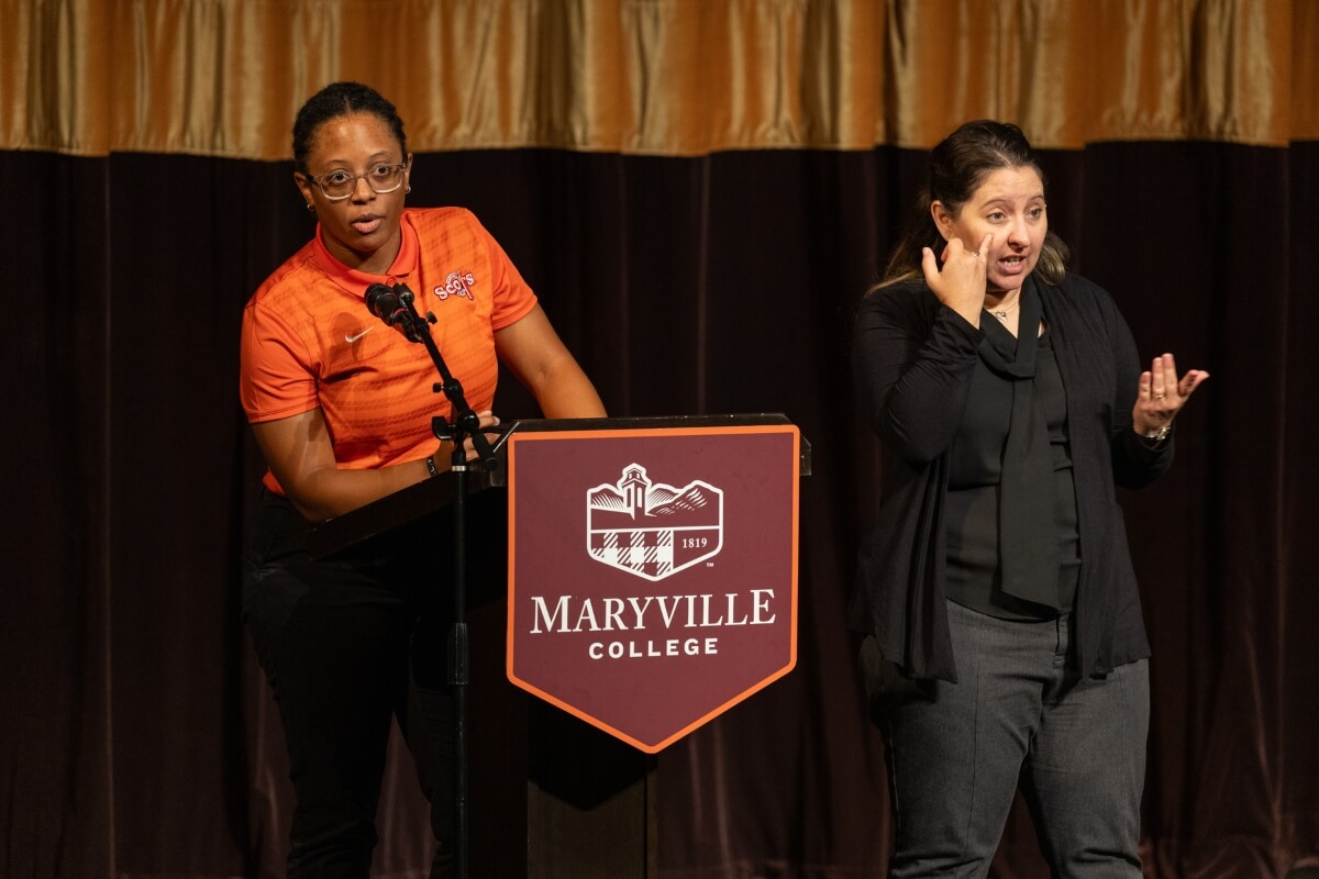 Photo of Brittney Washington and a sign language interpreter