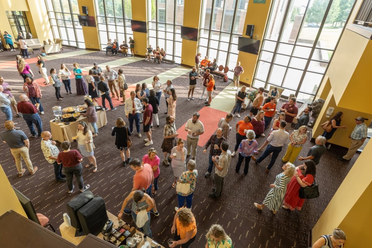 Photo of Maryville College faculty and staff members in the foyer of the Clayton Center for the Arts