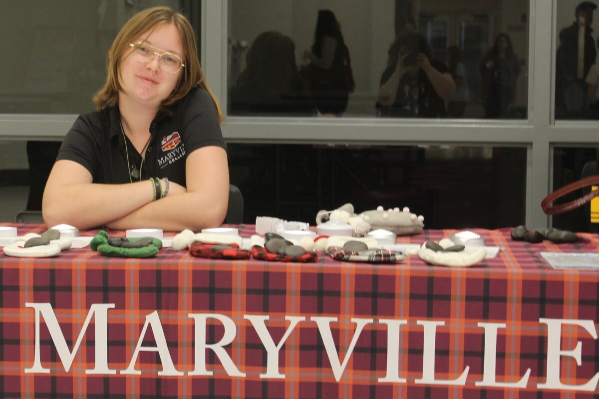 Photo of Catelee "Crow" Crow '24 representing Maryville College at a December sustainability event