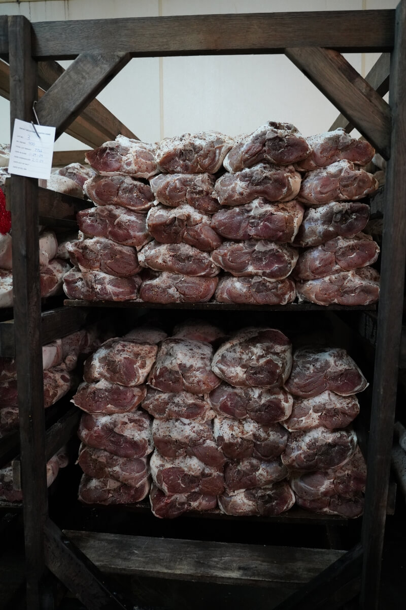 Photo of country hams on a rack