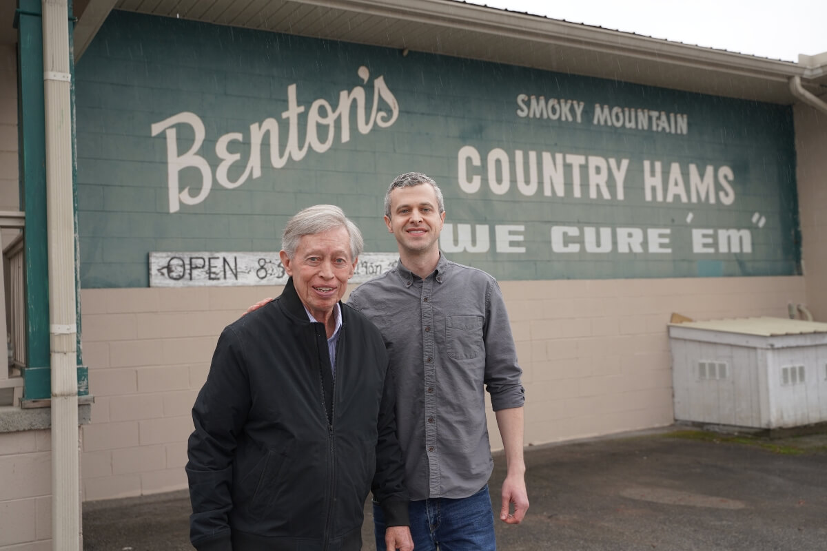 Photo of Allan and Darrell Benton in front of their store