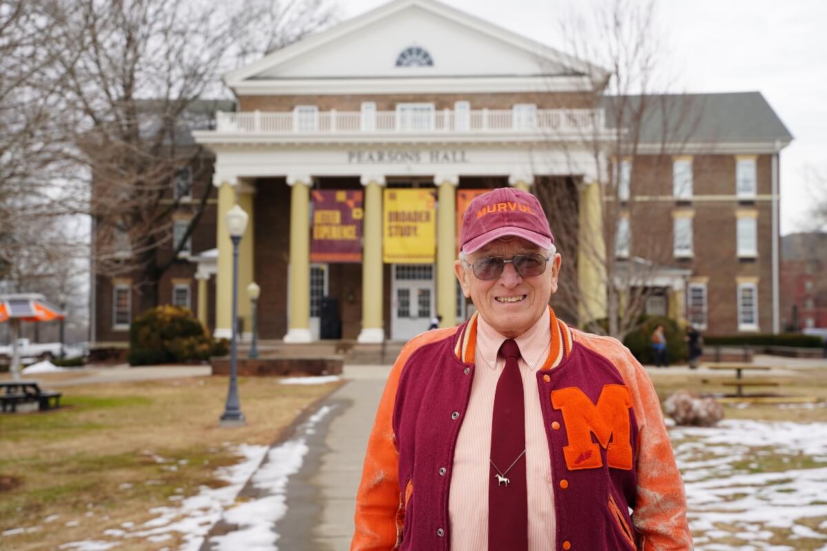 Maryville College's Dr. Hugh McCampbell '66 smiling and standing on Pearsons Lawn in January 2024