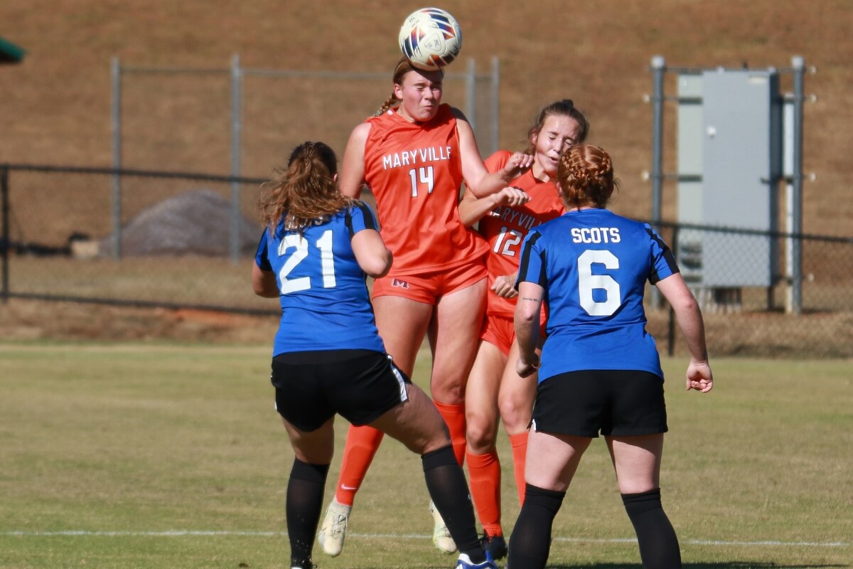 Photo of a Maryville College soccer player heading the ball