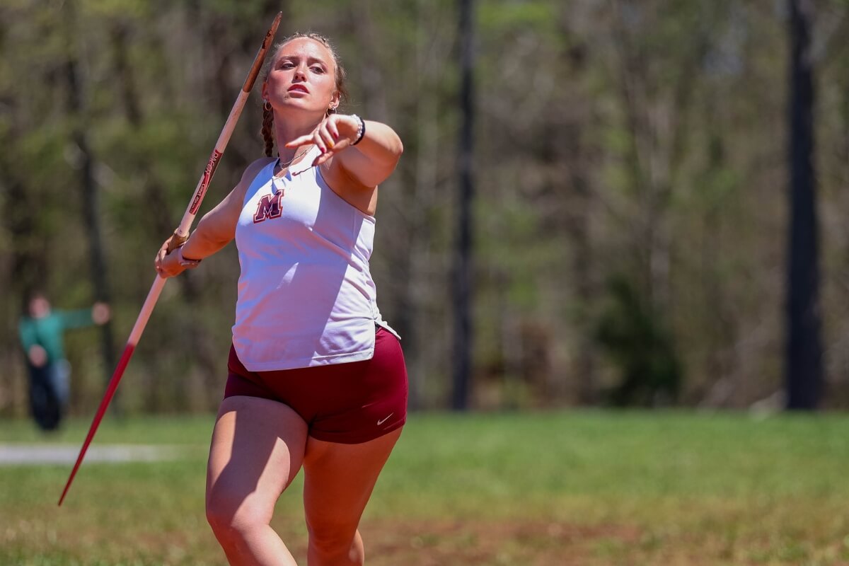 Photo of a MC track and field athlete throwing a javelin.