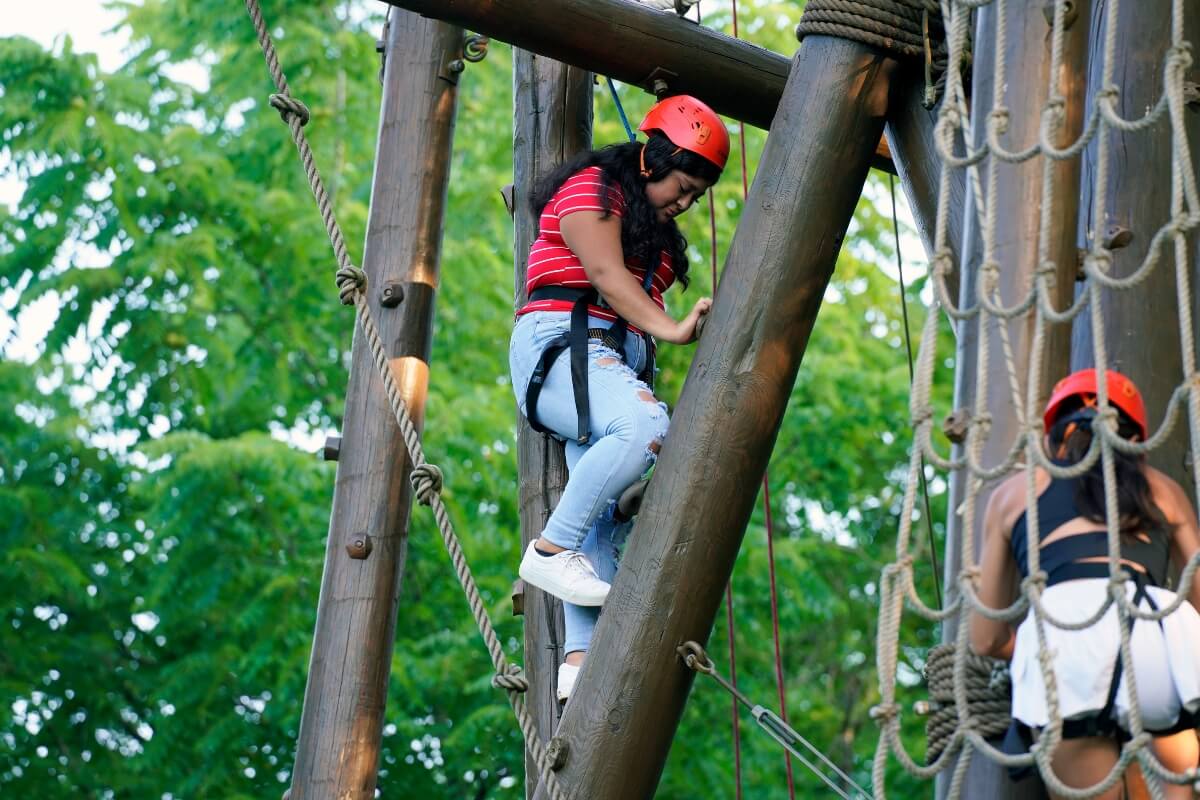 Photo of a girl on the Mountain Challenge Alpine Tower.