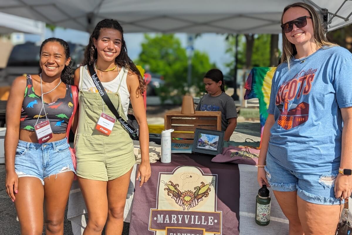 Photo of three SOAR participants at the Maryville Farmers Market