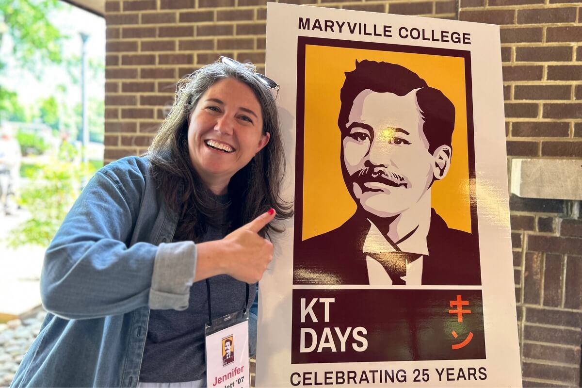 Goofy photo of Jennifer Phillips Triplett '07 beside a poster of Kin Takahashi