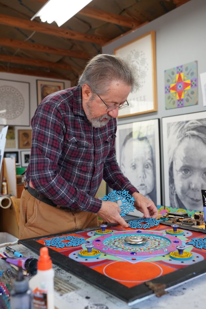 Photo of Dr. Carl Gombert working on an art project