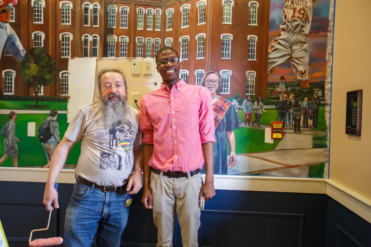 Photo of Dr. Carl Gombert with Brian Reid '16 in Fayerweather Hall.