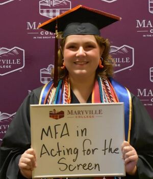 Photo of Jenni Cate Rhodes smiling at the camera