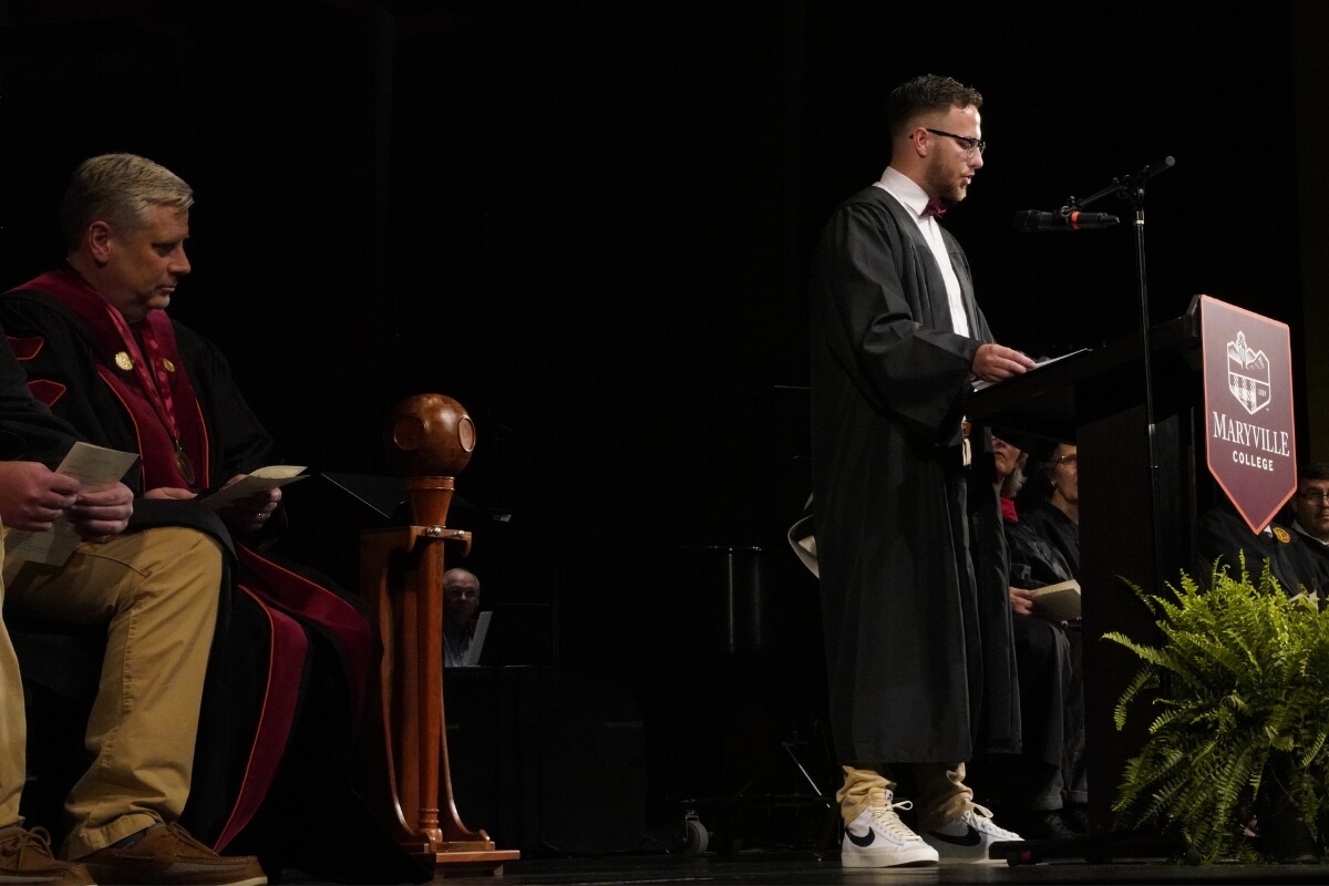 Photo of Kelton Bloxham at the podium