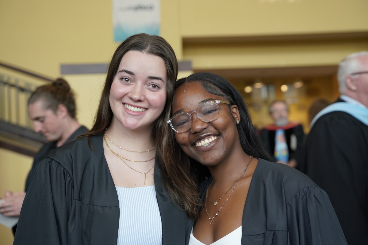 Photo of two smiling MC seniors