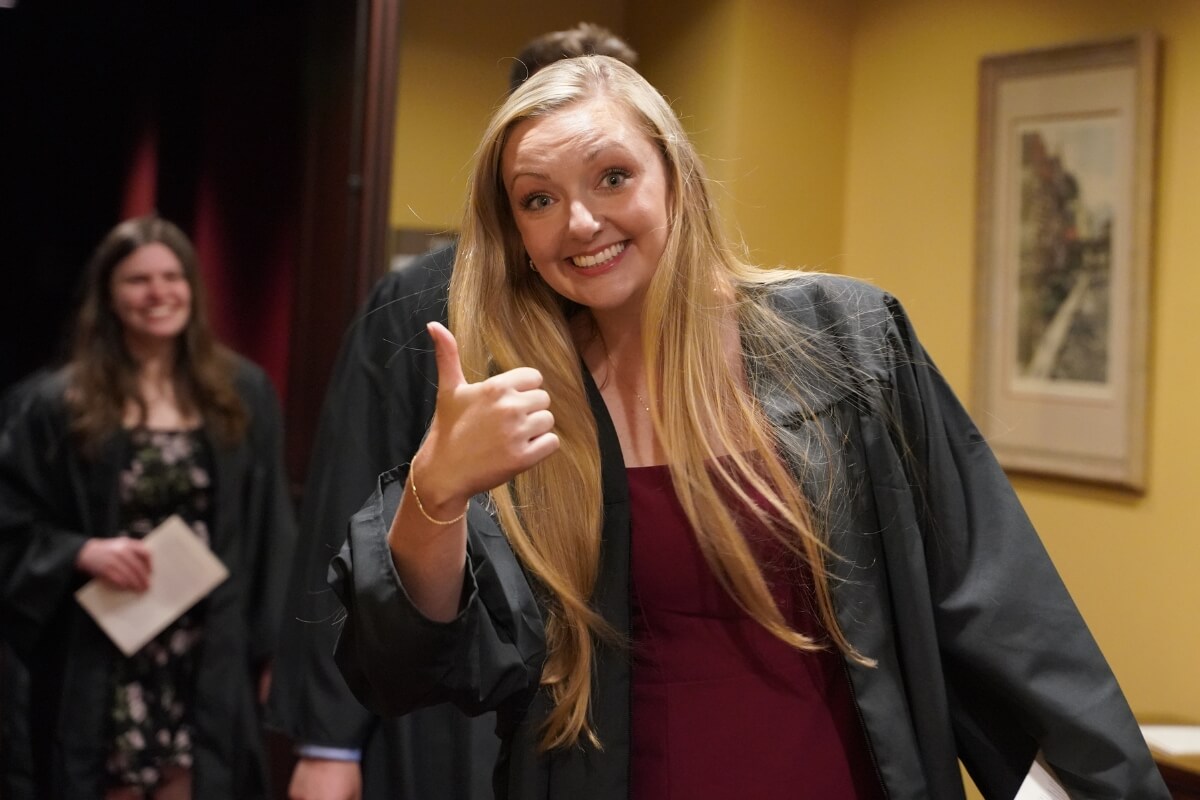 Photo of a Maryville College senior smiling and giving a thumbs up