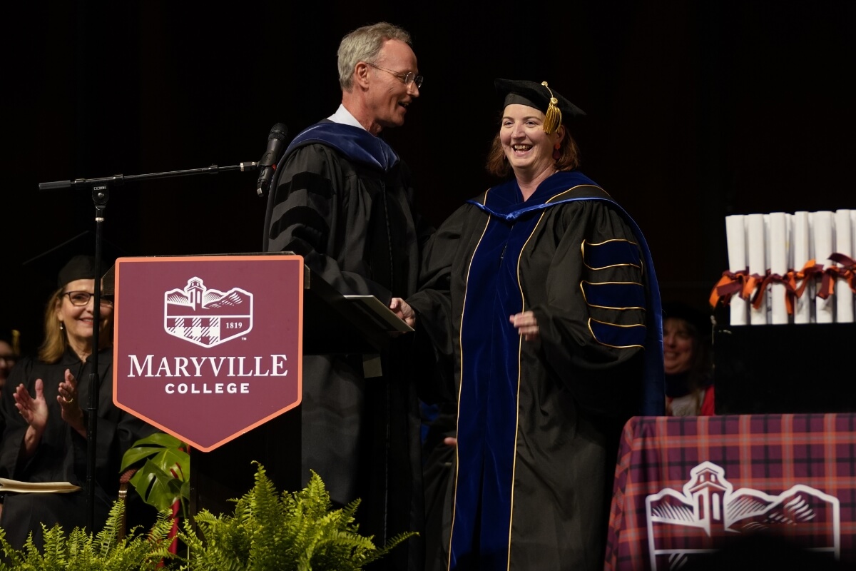 Photo of Dr. Dan Klingensmith and Dr. Gabie Kerr at Commencement 2024.