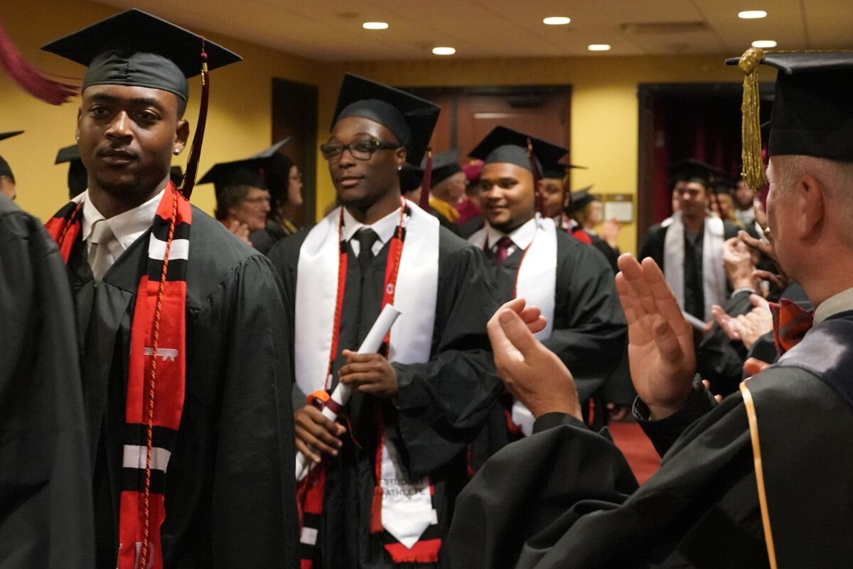 Photo of 2024 graduates leaving the Nutt Theatre